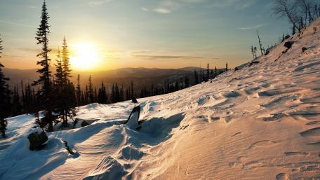 Winter Sunset Over Snowy Landscape wallpaper