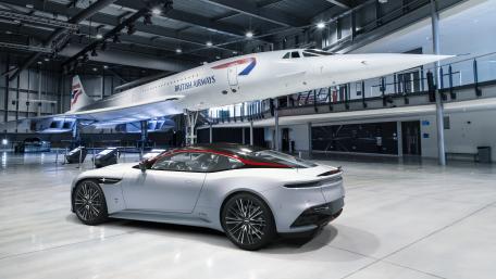 Aston Martin DBS in a Luxurious Hangar Scene wallpaper