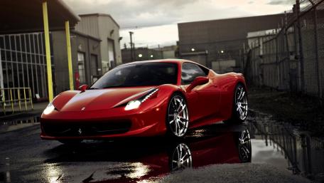 Sleek Red Ferrari in Urban Reflection wallpaper