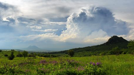 Vast Fields Under Dramatic Skies wallpaper