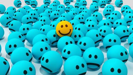 Bright Smiley Among Blue Emoticons Unleashes Joyful Vibes wallpaper