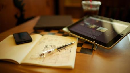 Modern Desk Setup with Gadgets and Notes wallpaper
