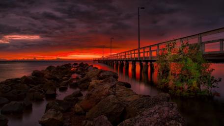 Stunning Sunset Over Serene Pier Scene wallpaper