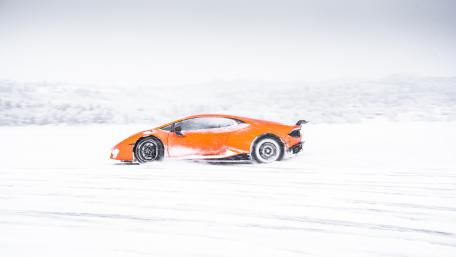Winter Lamborghini Adventure in Snowy Landscape wallpaper