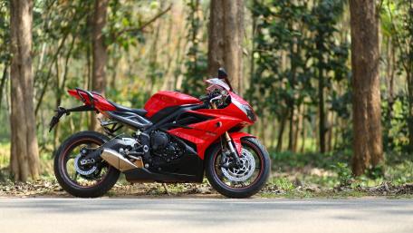 Triumph Daytona 675 in Scenic Forest Setting wallpaper