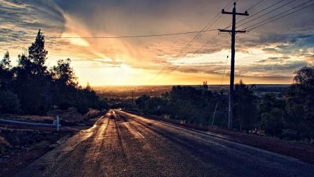 Lonely Road Under Electric Skies wallpaper