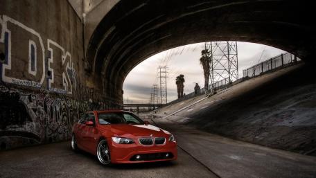 Urban BMW Elegance in an Industrial Setting wallpaper