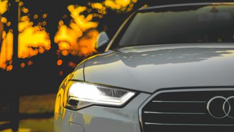 Sleek Audi Elegance Against a Stunning Sunset wallpaper