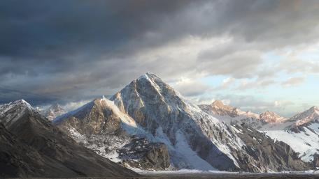 Majestic Mountain Summit Under Dramatic Skies wallpaper