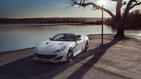Sleek White Ferrari Portofino by the Water wallpaper