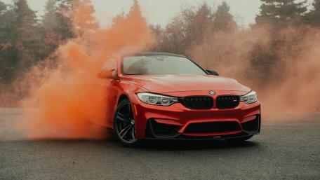 Dynamic BMW with Red Smoke Magic in Motion wallpaper