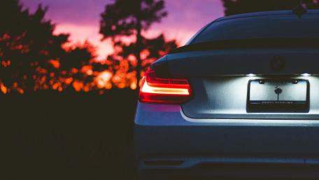 Sleek BMW at Dusk with Vibrant Sky Colors wallpaper