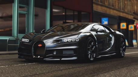 Sleek Bugatti Chiron Racing Through the Streets wallpaper