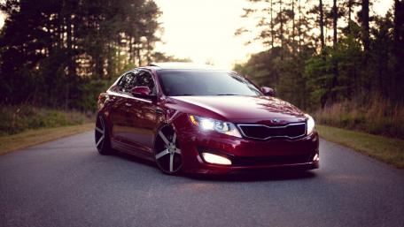 Sleek Sedan with Vossen Wheels Enhancing Style wallpaper