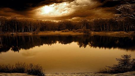 Serene Lake Under Dramatic Skies wallpaper