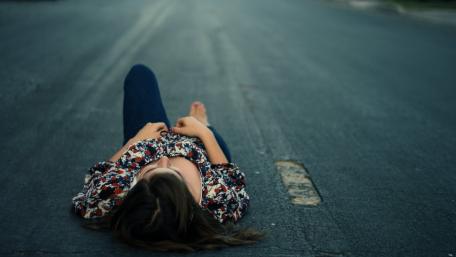 Roadside Serenity of a Woman Relaxing in Leisure Time wallpaper