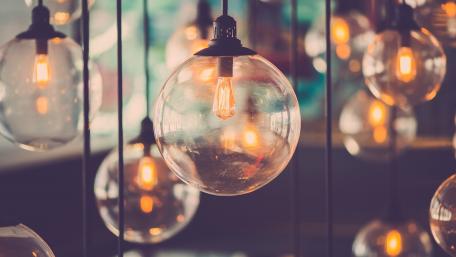 Illuminated Elegance of Hanging Light Bulbs wallpaper