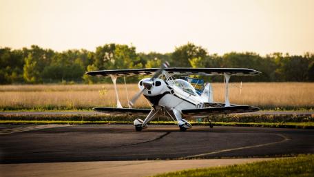 Small Plane Preparing for Takeoff on Sunny Runway wallpaper