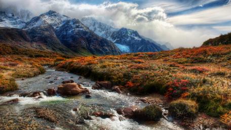 Majestic Mountain Landscape with Serene Creek Flowing wallpaper