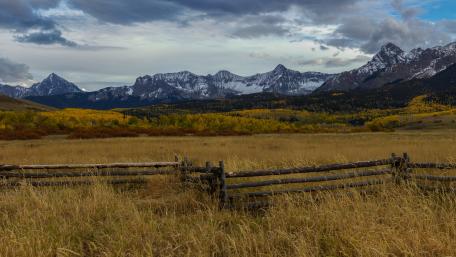 Serene Autumn Landscape with Majestic Mountains wallpaper