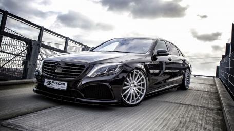 Sleek Mercedes-Benz S-Class with Stunning Wheels and Clouds Above wallpaper