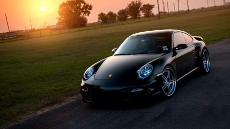 Sleek Black Porsche 911 at Sunset wallpaper