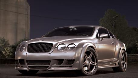 Sleek Bentley Continental GT in Urban Nightscape wallpaper