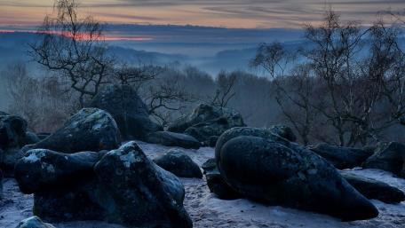 Mystical Boulders in Serene Landscape wallpaper