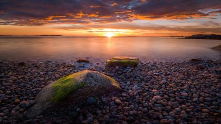 Serene Sunset Over Pebble Beach Scene wallpaper