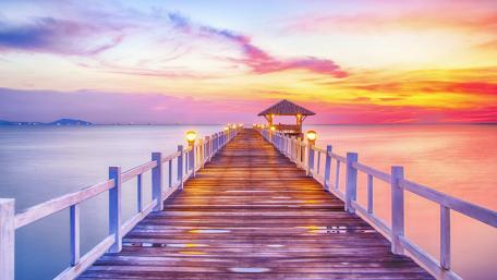 Serene Sunset Over Tranquil Pier Waters wallpaper