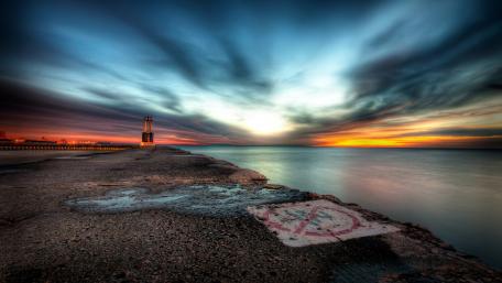 Serene Sunset Over Tranquil Shoreline wallpaper