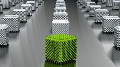Dynamic Green Cube Amongst Monochrome Structures wallpaper