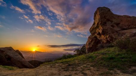 Golden Sunset Over Serene Mountainscape wallpaper