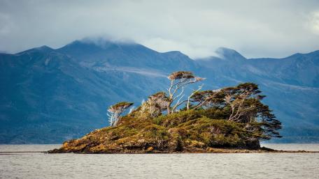 Serene Islet Embraced by Mountains wallpaper