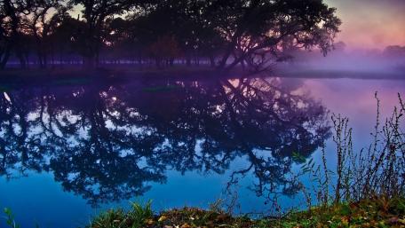 Serene Dusk Reflection Over a Purple Lake wallpaper