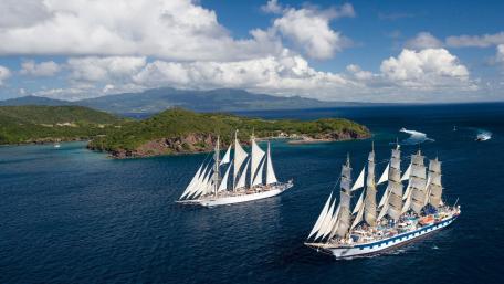 Majestic Masted Ships on Serene Waters wallpaper