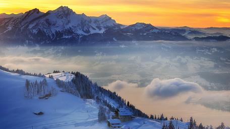 Majestic Winter Sunrise Over Swiss Alps wallpaper