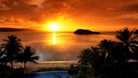 Tropical Sunset Over Serene Waters wallpaper