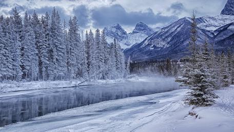 Serene Winter River Landscape in the Mountains wallpaper