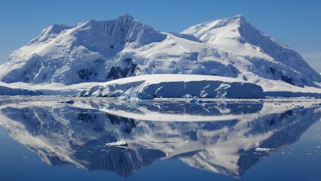 Majestic Ice Mountains Reflected in Tranquil Waters wallpaper