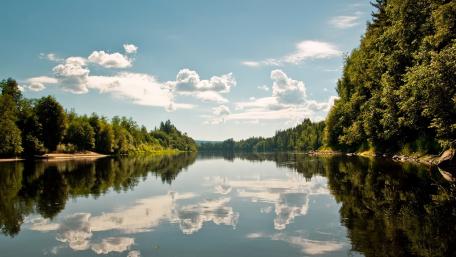 Tranquil River Reflecting a Beautiful Sky wallpaper