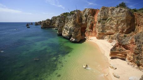 Breathtaking Coastal View of Cliffs and Beach Waves wallpaper