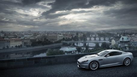 Elegant Aston Martin DBS Overlooking a Cityscape wallpaper