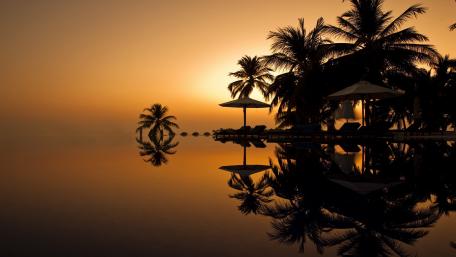 Tranquil Tropical Sunset Reflection wallpaper