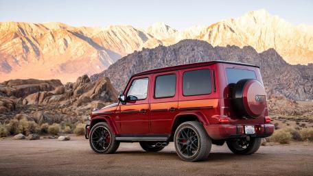 Sleek Mercedes-Benz G-Class Amidst Majestic Mountains wallpaper