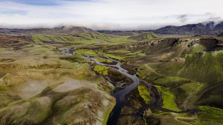Serene River Landscape Amidst Majestic Mountains wallpaper
