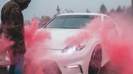 Dynamic Car with Red Smoke Effects wallpaper