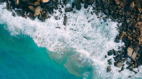 Ocean Melody and Rocky Shoreline wallpaper