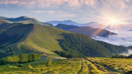 Majestic Green Mountains at Sunrise wallpaper