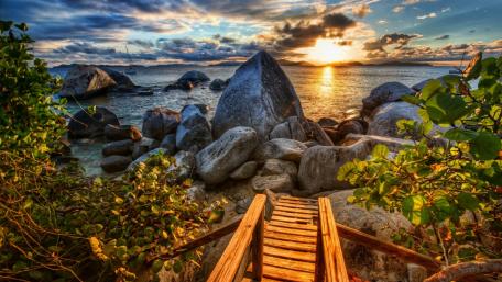 Golden Sunset Over Rocky Shores wallpaper